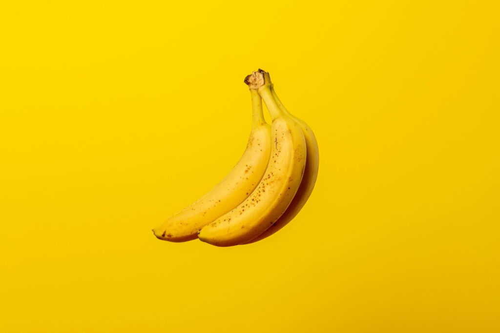 High-quality image showing ripe bananas on a clean background, emphasizing their nutritional value of banana